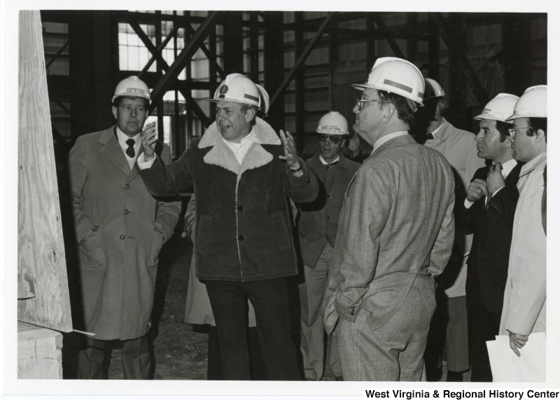 Congressman Nick Rahall II, second from left, taking a tour of the Stone and Webster Engineering Corporation in Piketon, Ohio, with an unidentified group of people.