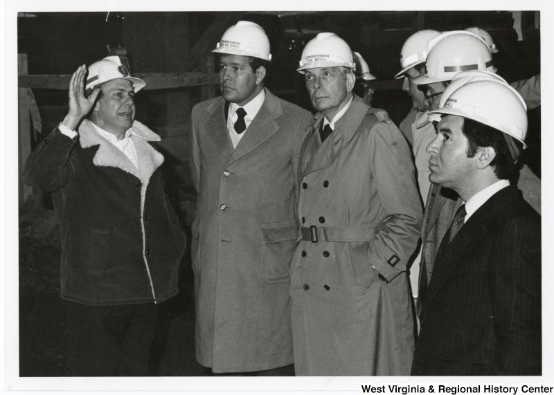 From left to right: an unidentified man; Congressman Bob McEwen (R-OH); Congressman Tom Bevill (D-AL) and Congressman Nick Rahall II (D-WV) taking a tour of the Stone and Webster Engineering Corporation.