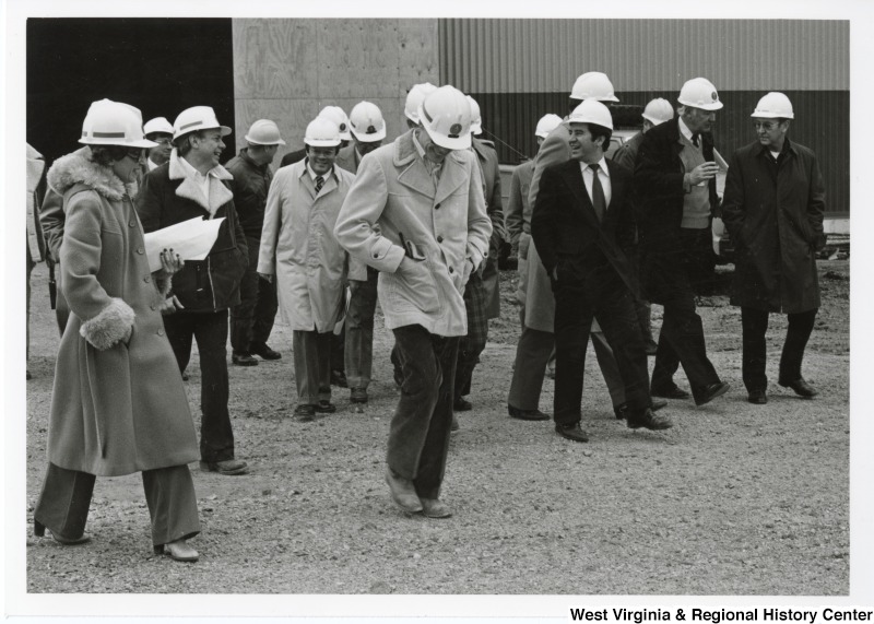 Congressman Nick Rahall II, third from the right, with an unidentified group of people taking a tour of the Stone and Webster Engineering Corporation.