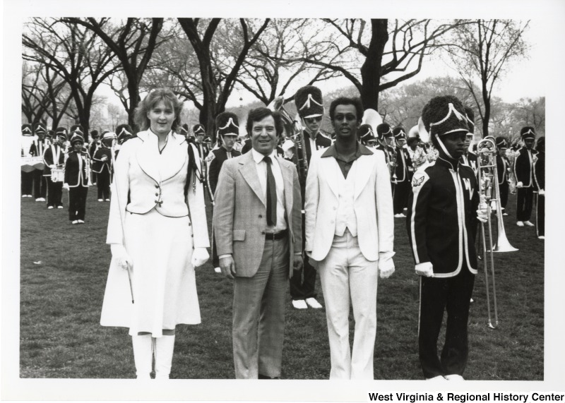 Congressman Nick Rahall II (center) with a unidentified marching band.