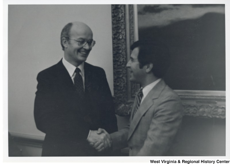 Congressman Nick Rahall II shaking the hand of the Secretary of Interior, James Watt.