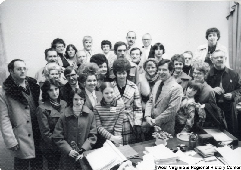 Congressman Nick Rahall II with a unidentified group of people.