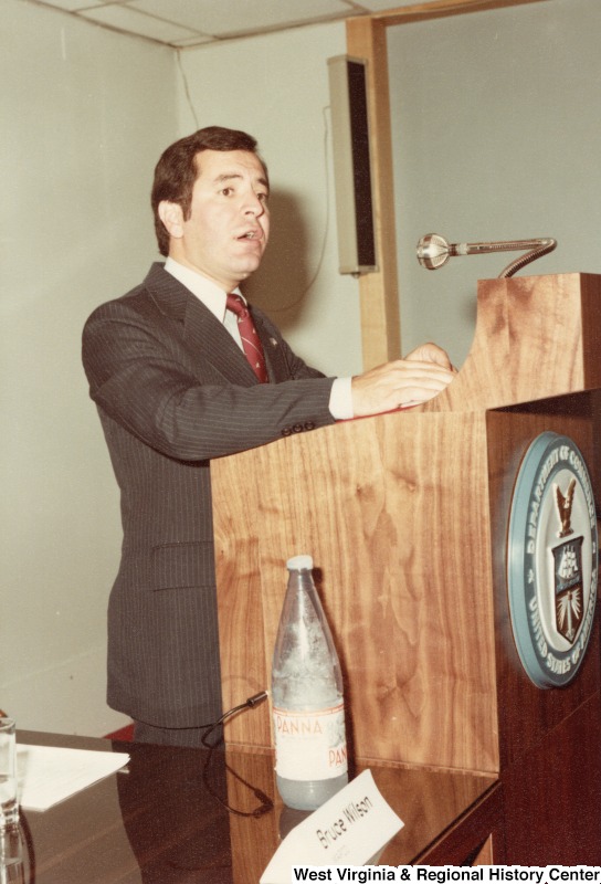 Congressman Nick Rahall II speaking at a podium.