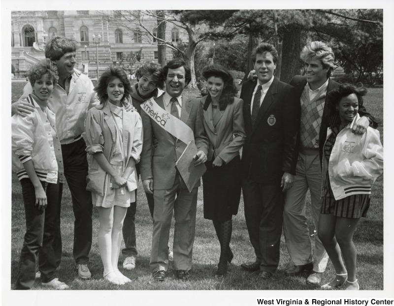 Congressman Nick Rahall II (center) with a group of people from the March of Dimes National Organization. Rahall is wearing sash saying March of Dimes Walk America.