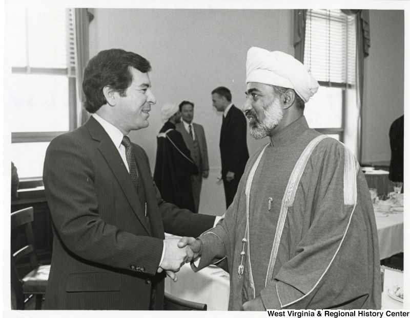 Congressman Nick Rahall II shaking the hand of His Majesty Qaboos bin Said, Sultan of Oman during a coffee meeting.