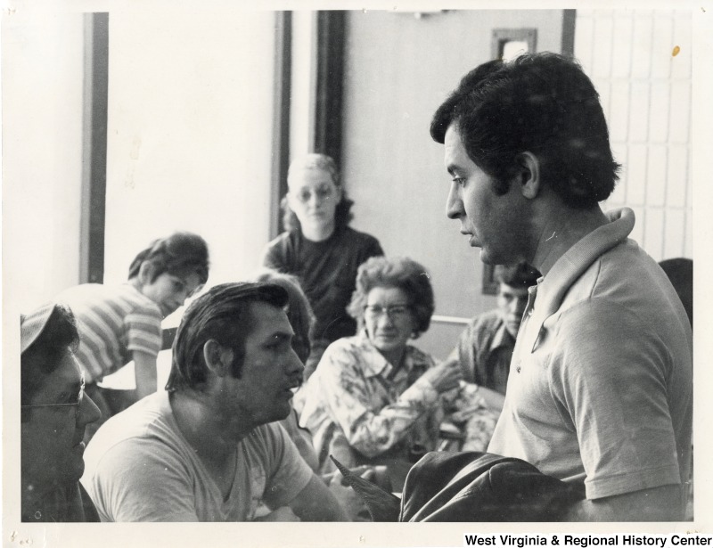 Congressman Nick Rahall II with a unidentified group of people.