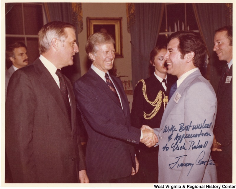 From left to right: Vice President Walter Mondale; President Jimmy Carter; Congressman Nick Rahall II (D-WV); and Congressman Jerry Huckaby (D-LA) at the White House for an early Carter support dinner. The photograph is signed: "With best wishes and appreciation to Nick Rahall." Jimmy Carter.