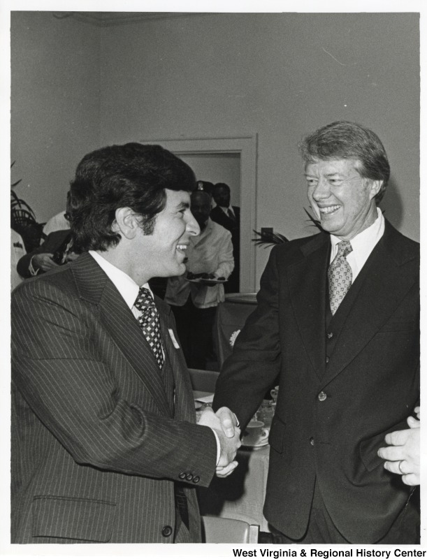 Congressman Nick Rahall II shaking the hand of President Jimmy Carter.