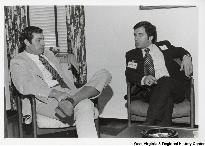 Congressman Nick Rahall II (right) speaking with an unidentified man with Union Carbide.
