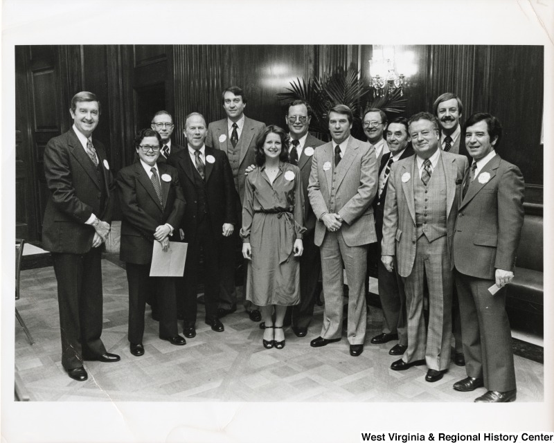 Congressman Nick Rahall II (first on the right) with a unidentified group of men and one woman.