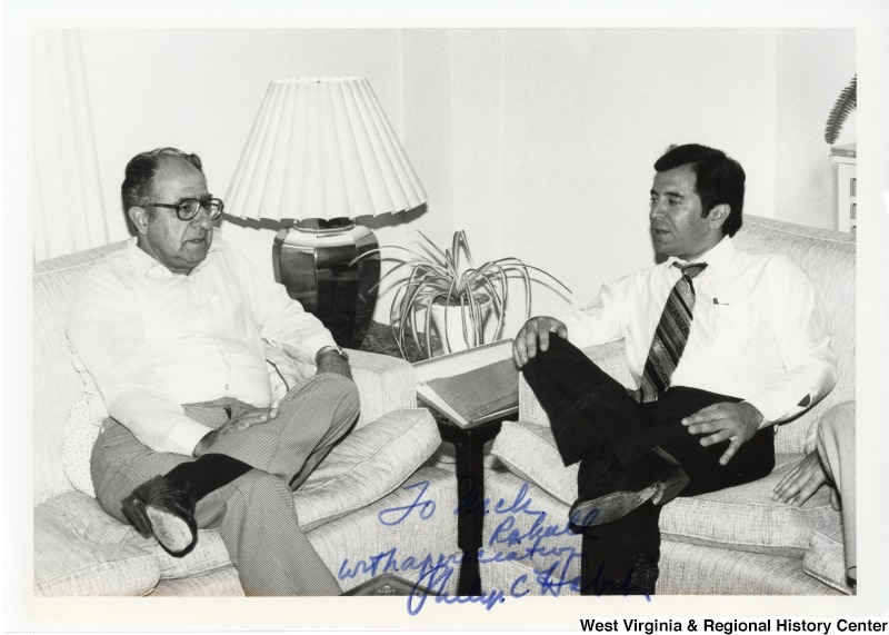 Left to right: Philip C. Habib, a U.S. diplomat and ambassador, sitting on a couch speaking to Congressman Nick Rahall II. The photograph is signed "To Nick, with appreciation. Philip C. Habib."