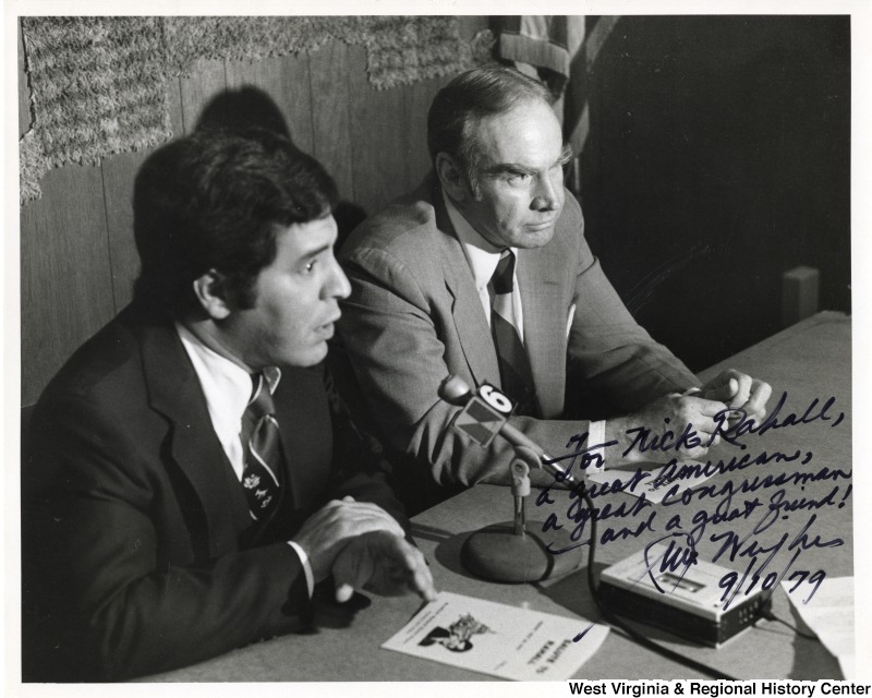 Congressman Nick Rahall II and Congressman Jim Wright speaking to an unidentified audience. The photograph is signed: " To Nick Rahall, A great American, a great Congressman, and a great friend! Jim Wiright. 9/10/79."