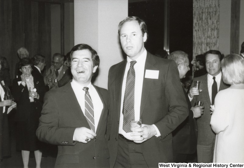 Congressman Nick Rahall II with an unidentified man at one of his birthday parties.