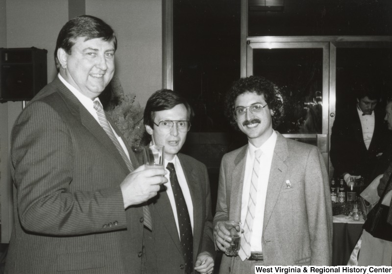 Three unidentified men at one of Congressman Nick Rahall's birthday parties.