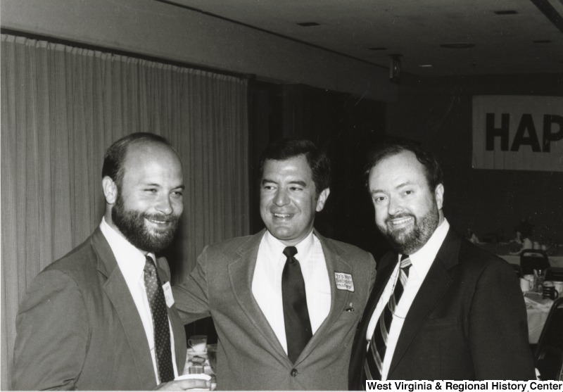 Congressman Nick Rahall II (center) with two unidentified men at one of his birthday parties.