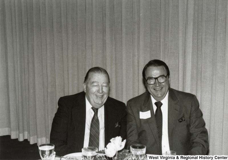 Senator Jennings Randolph eating with an unidentified man at one of Congressman Rahall's birthday parties.