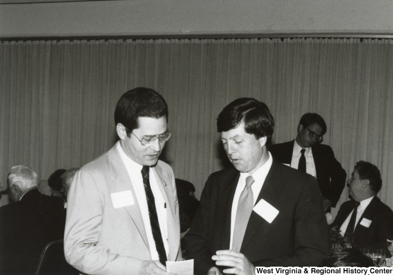 Two unidentified men talking at Congressman Nick Rahall's birthday party.