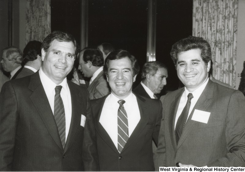Congressman Nick Rahall II (center) with two unidentified men at his birthay party.