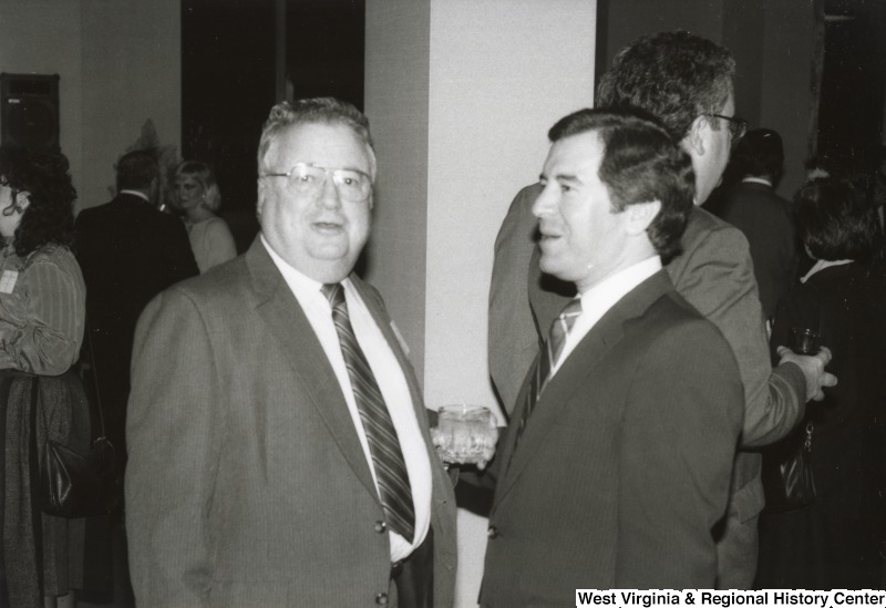 Congressman Nick Rahall II (right) speaking with an unidentified man at his birthday party.