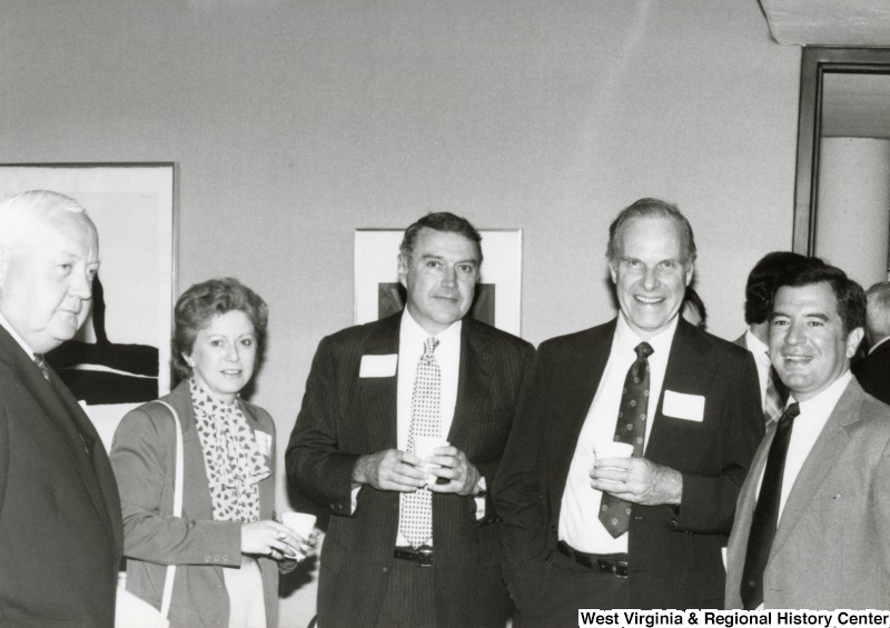 Congressman Nick Rahall II (first on the right) with three unidentified men and one woman at his birthday party.