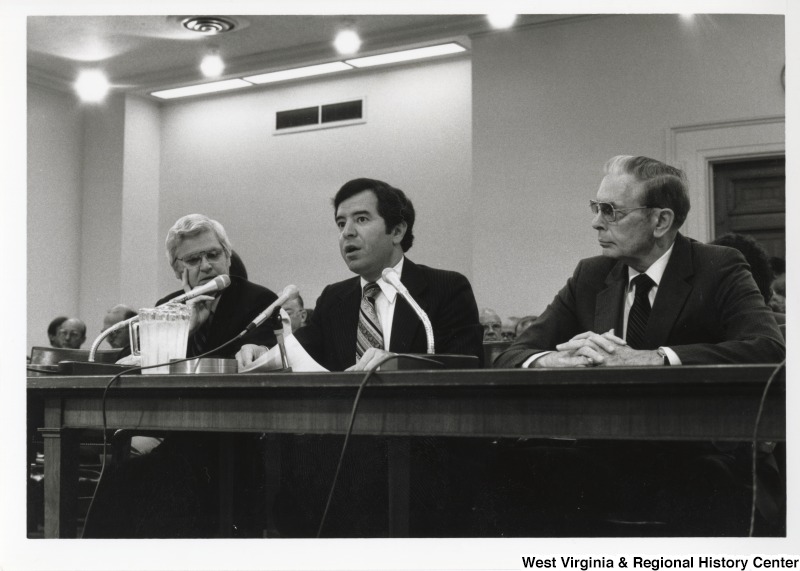 Congressman Nick Rahall II (center) speaking at an unidentified meeting or hearing.