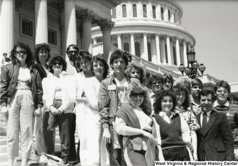 Congressman Nick Rahall II (front right corner) with an unidentified group of men and women on the steps of the Capitol building.