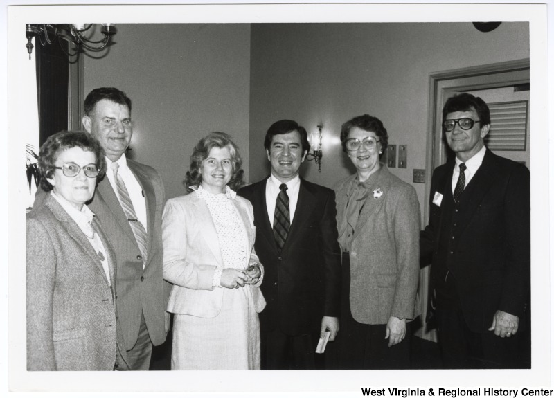 Congressman Nick Rahall II with five unidentified West Virginians.