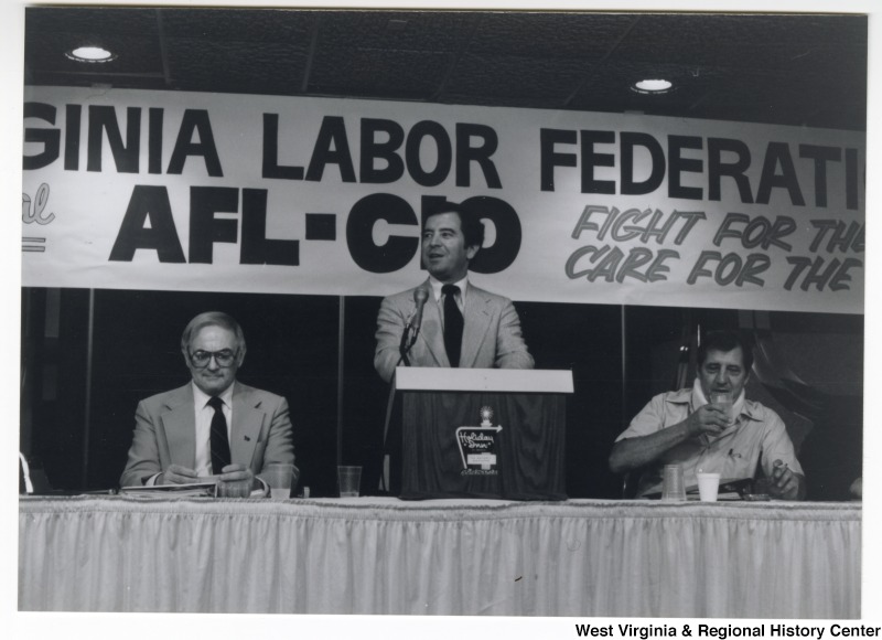 Congressman Nick Rahall, II (center) speaking at a West Virginia Labor Federation, AFL-CIO meeting.