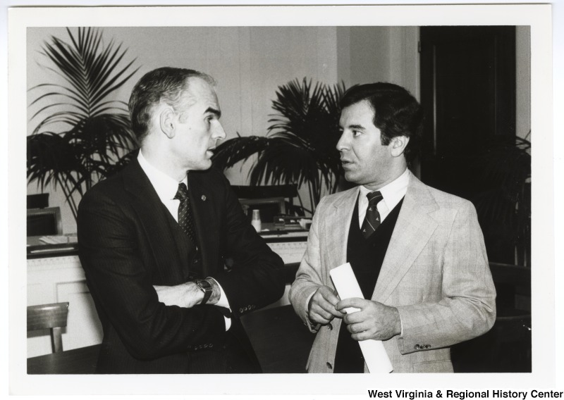 Secretary of Energy Donald P. Hodel (left) and Congressman Nick Rahall, II (right) having a discussion at a House of Representatives Coal Group meeting.