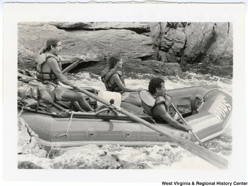 Congressman Nick Rahall, II (right) and two unidentified people whitewater rafting down the Tuolumne River in central California.