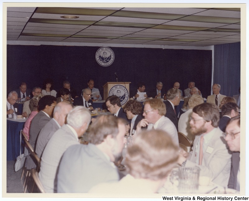 Senators Jennings Randolph (left in back row) and Robert C. Byrd (third from left in back row) as well as Congressman Nick Rahall, II (fourth from right in back row) at a banquet following the groundbreaking of the Beckley Sewage Treatment plant.