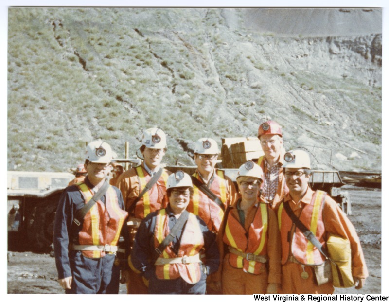 Congressman Nick Rahall, II (front right) with an unidentified group of people in miners' uniforms at Rocky Mountain Energy Company in Wyoming.