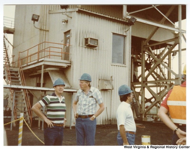 Congressman Nick Rahall, II (second from right) with three unidentified men on a tour at Rocky Mountain Energy Company.