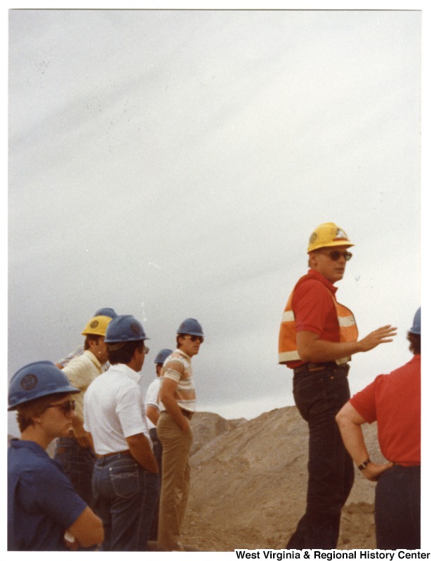 Congressman Nick Rahall, II (fourth from left) with an unidentified group of men and women on a tour at Rocky Mountain Energy Company.