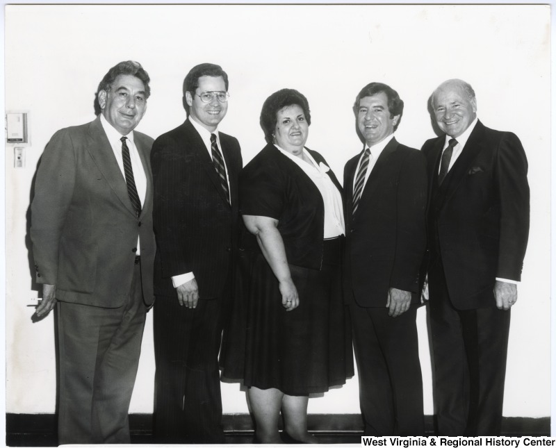 From left to right:  West Virginia Secretary of State A. James Manchin, Congressmen Alan Mollohan, an unidentified woman, Congressman Nick Rahall, II, and Chester Grossi at the Weirtonian Lodge 183 for a Columbus Day Dinner-Dance with the Italian Sons and Daughters of America.