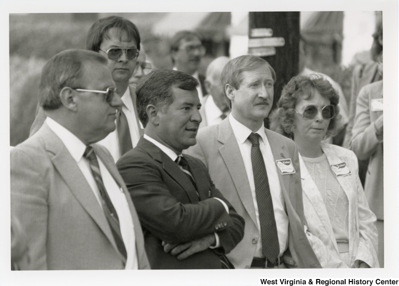 Congressman Nick Rahall II (second from left) with five unidentified men and one unidentified woman.