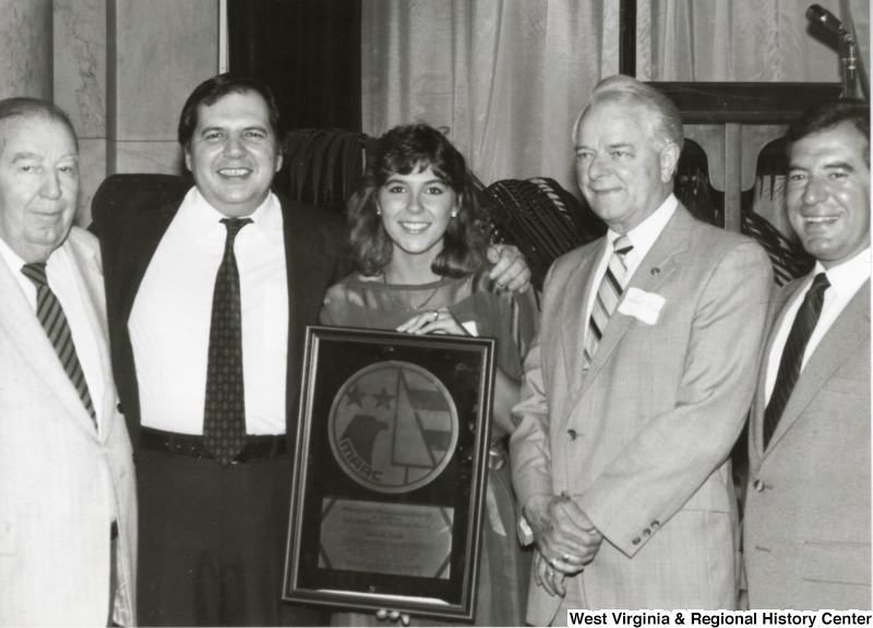 From left to right: Senator Randolph, an unidentified man and woman, Senator Byrd, and Congressman Rahall at an event.