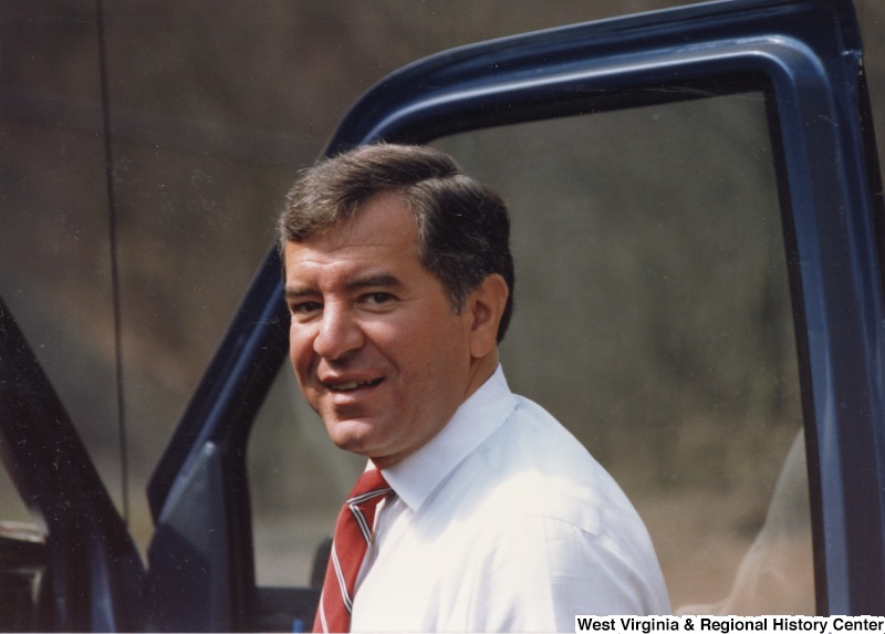 Photograph of Congressman Nick Rahall, II getting into a vehicle.