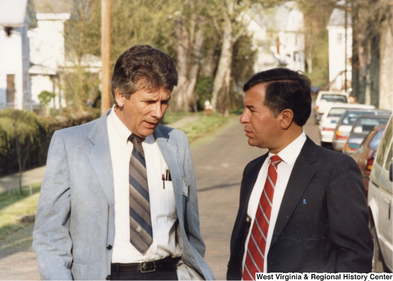 Congressman Nick Rahall, II (right) speaking with an unidentified man.