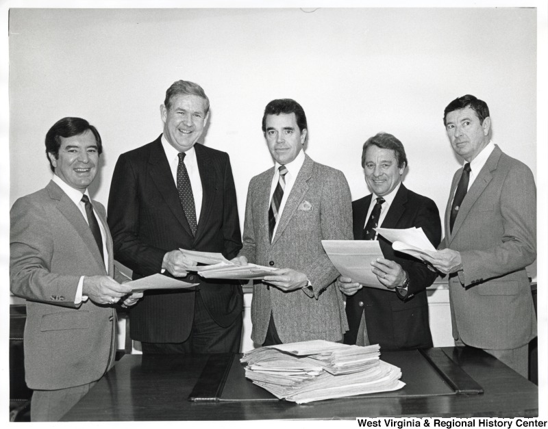 L-R: Representative Nick J. Rahall (D-W.Va.), Representative John Murtha (D-PA), Representative Doug Applegate (D-OH), an unidentified man, Representative Austin Murphy (D-PA). Congressman Nick Rahall and men of the Congressional Coal Group holding papers pose for a photo.