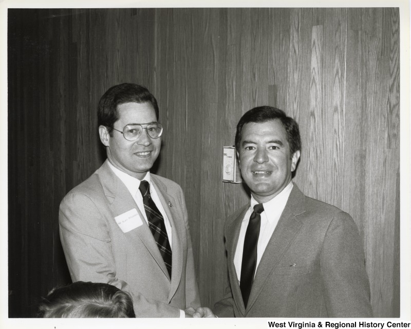 Representative Alan Mollohan (D-W.Va) shakes hands with Representative Nick J. Rahall (D-W.Va.).