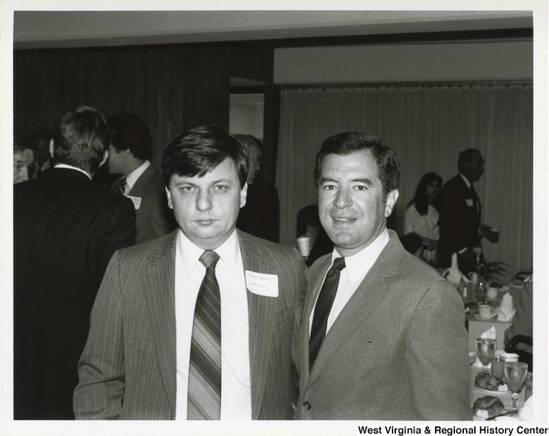 Representative Nick J. Rahall (D-W.Va.) stands next to John Jarvis, a member of the United Mine Workers of America (UMWA) at a dinner.