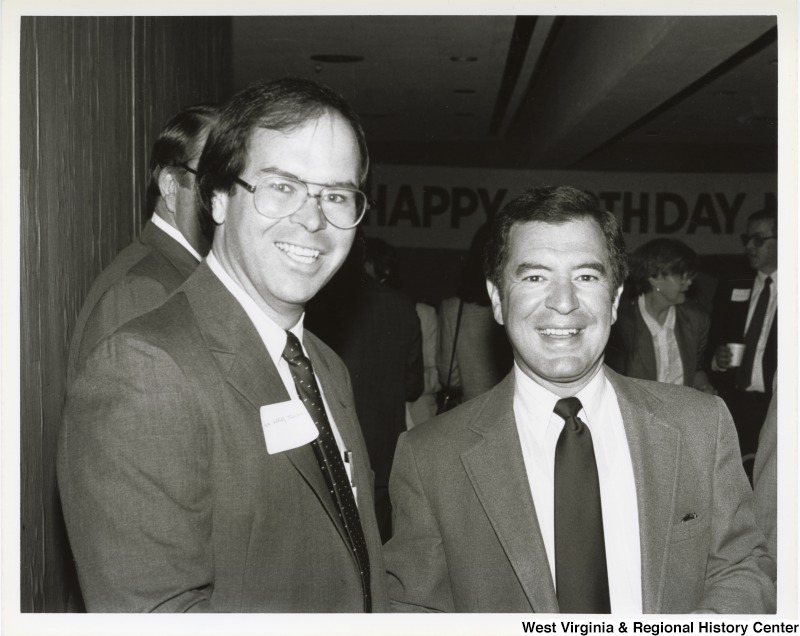 Representative Nick J. Rahall (D-W.Va.) stands next to Representative Harley O. Staggers, Jr. (D-W.Va.) at a dinner.