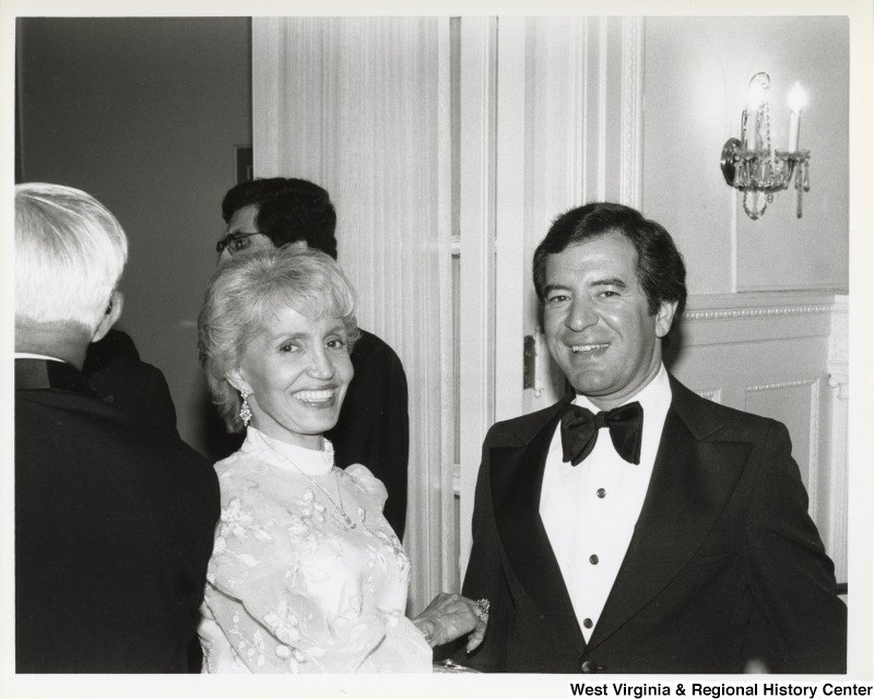 Representative Nick J. Rahall (D-W. Va.) stands next to an unidentified woman to pose for a picture at the Lebanese Embassy.