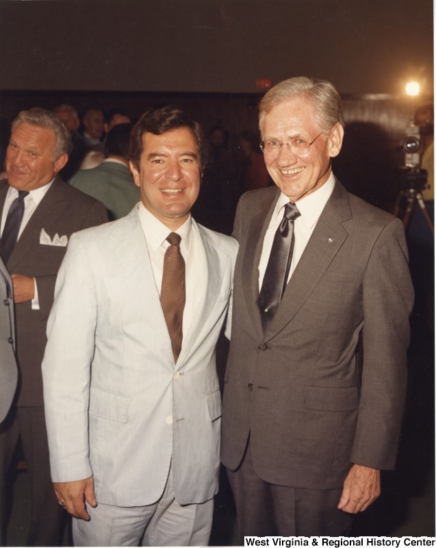 L-R: Stanley Preiser, Representative Nick J. Rahall (D-W.Va.), United States District Judge Kenneth Keller Hall (W.Va.). Representative Nick J. Rahall standing with District Judge Kenneth Keller Hall at an event. Stanley Preiser is seen off to the side.