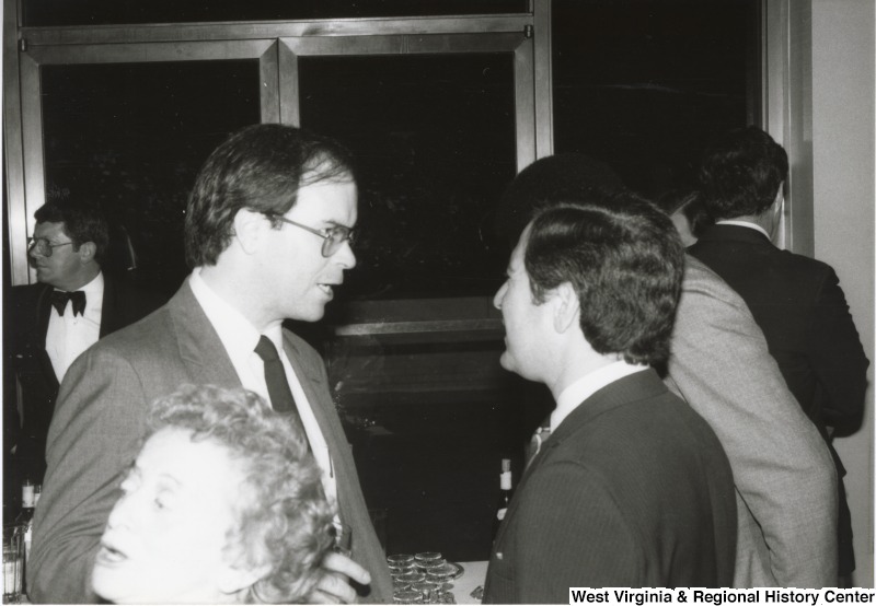 On the left, Representative Harley O. Staggers, Jr. (D-W.Va.) stands talking with Representative Nick J. Rahall (D-W.Va.).