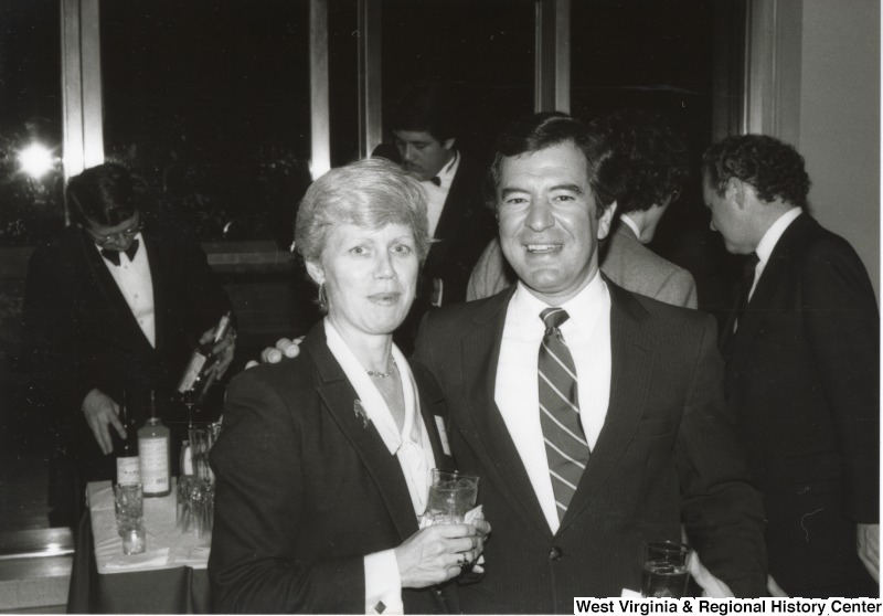 On the right, Representative Nick J. Rahall (D-W.Va.) with an unidentified woman at an event.