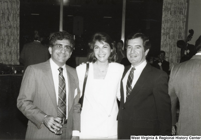 On the right, Representative Nick J. Rahall (D-W.Va.) stands with an unidentified man and woman.