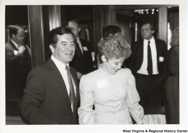 Representative Nick J. Rahall (D-W.Va.) stands to the left of an unidentified woman.