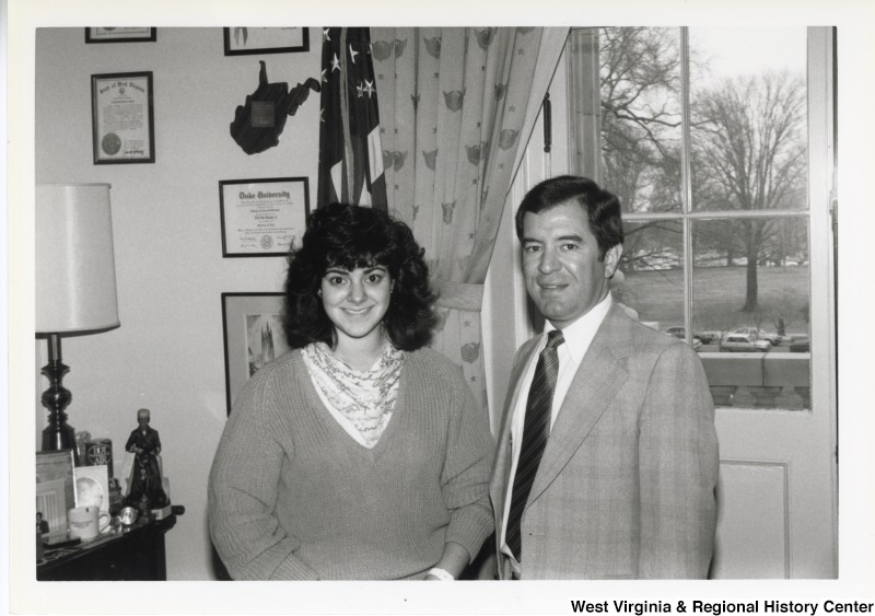 On the right, Representative Nick J. Rahall (D-W.Va.) with an unidentified woman in an office.